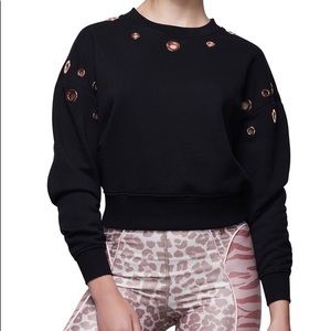 Good American Peepin’ black grommet sweatshirt size M